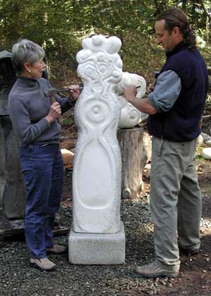 Tom Small, donor to the Festival of Trees of a fabulous piece of sculpture (not pictured), shares his knowledge of stone carving with Sondra Bayley, Co-chair of the Live Auction